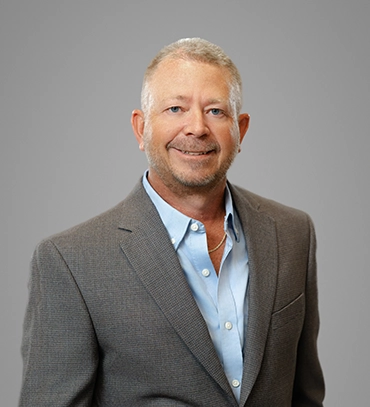 Headshot of SHAZAM Executive Vice President and Chief Financial Officer Scott Dobesh